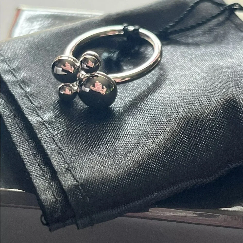 Silver Calvin Klein rotating ring in size 8 comes with box and satin pouch
